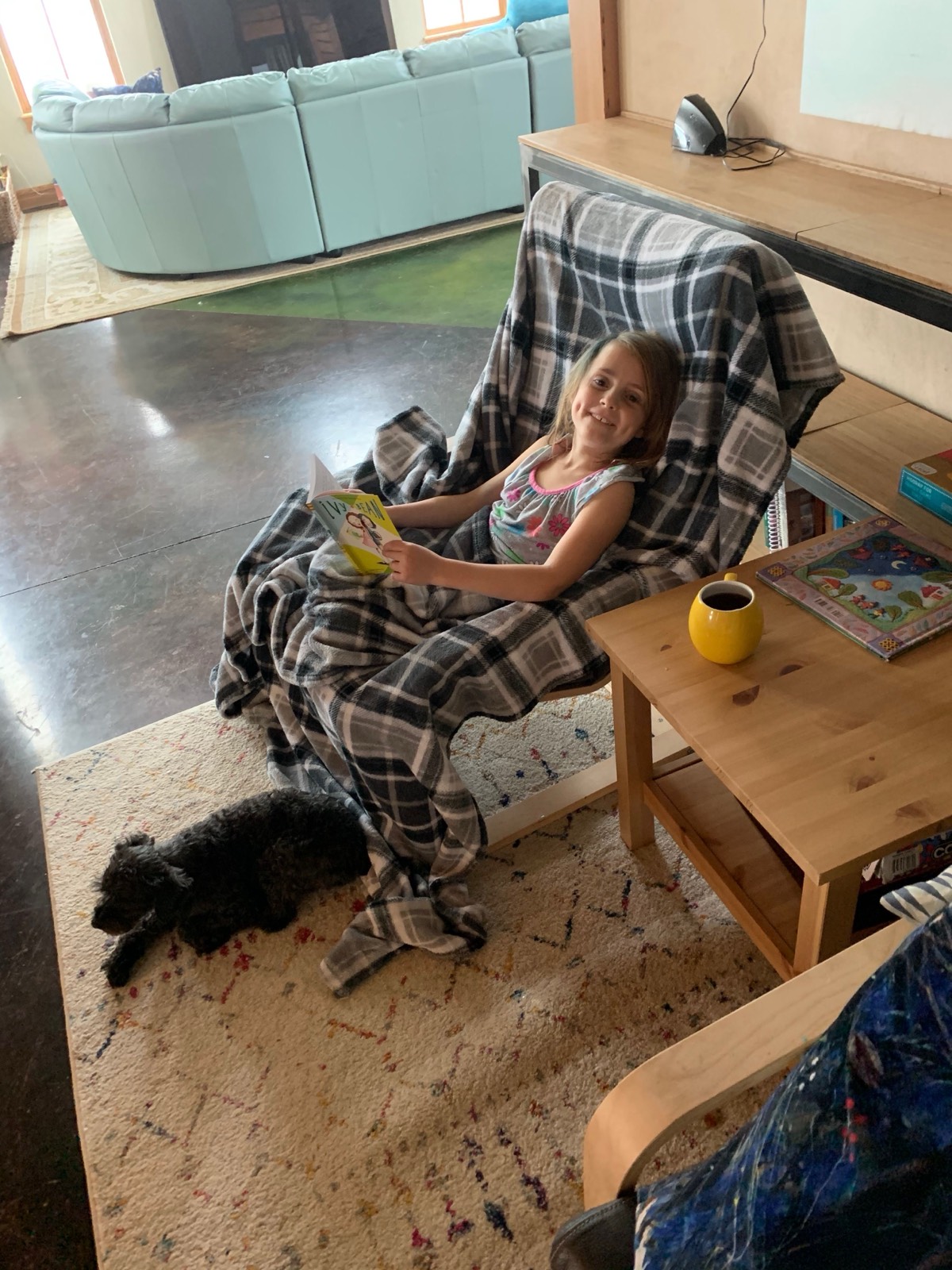 Birdie drinking morning tea and a read...