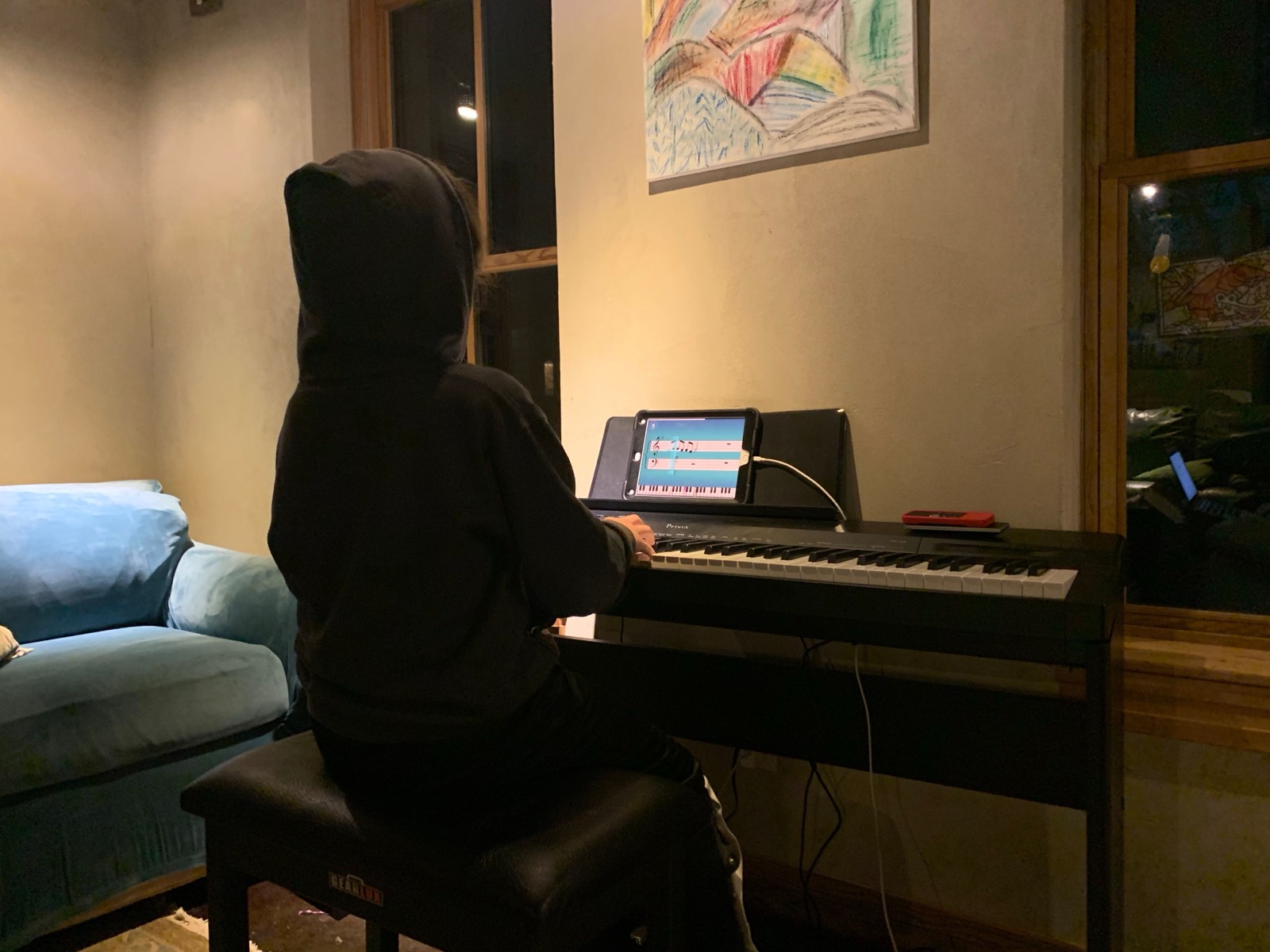 Huxley loves to play pop songs with the Simply Piano app. Africa by Toto