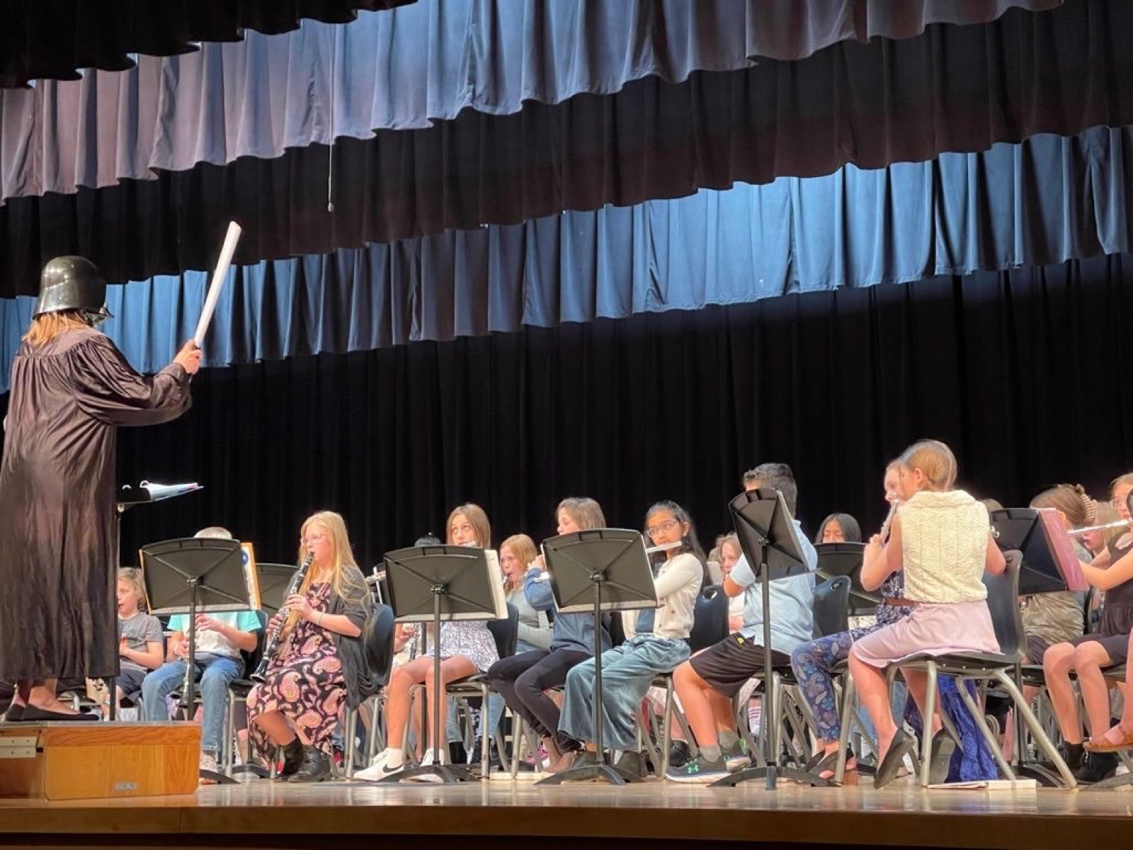 Playing the Star Wars theme. Brigetta loved that her teacher wore the Darth Vader getup.